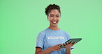 Happy woman, portrait and volunteer on green screen with tablet, sign up and NGO management. Female donor, tech and smile on chroma key for new recruit, financial aid and donation balance on bank app