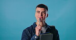 Student, thinking and man in studio with pen for planning, problem solving or solution on blue background. University, question and male person for wonder, contemplating or decision with mockup