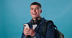 Student, phone and laugh with portrait, funny joke or meme on blue background for social media. Smile, happy and young gen z man reading from app on smartphone with website for communication mockup