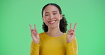 Green screen, smile and woman with peace hand sign, symbol or icon isolated on studio background. Happy portrait, excited and young funny girl with positive energy, carefree and emoji mockup