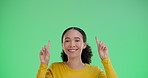 Portrait, happy woman and pointing up on green screen for  ads isolated on studio background. Promo, deal and hand gesture for sales offer, news and commercial marketing on mockup space coming soon