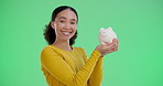 Woman, studio and happy with piggy bank in green screen for savings or investment for university fees. Female person, portrait and happy or smile in confidence as college student for financial profit