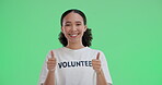 Volunteer, thumbs up and woman in green screen, portrait and happy for donation to charity and community service. Banner, mockup and person with kindness in studio background, space and non profit