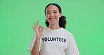 Happy woman, volunteer and ok hand on green screen for agreement or approval on studio background. Portrait, female ngo worker and agreement emoji, yes sign or like for good job on charity mockup