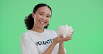 Volunteer, woman or piggy bank with money on green screen for donation, NGO project or happy to help. Charity, portrait or coin container for community funds or investment on studio background mockup