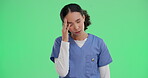 Woman, nurse and headache in stress, burnout or mistake on greenscreen background for hospital mockup. Frustrated, sad physician or medical person for grief, loss or failed surgery with healthcare