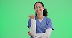 Nurse, woman and happy with pointing on green screen for healthcare information or advertising medicine. Medical expert, portrait or hand gesture for deal and announcement on studio background mockup