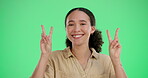 Green screen, symbol and woman with peace hand sign, gesture or icon isolated on studio background. Happy portrait, excited and young funny girl with positive energy, carefree and emoji mockup
