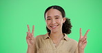 Green screen, gesture and woman with peace hand sign, symbol or icon isolated on studio background. Happy portrait, excited and young funny girl with positive energy, carefree and emoji mockup