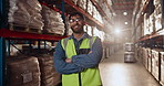 Man, confidence and warehouse in supply chain for logistics, quality control and stock management for delivery. Male person, arms crossed and packaging with freight, manufacturing or shipping company