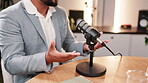 Businessman, hands and talking with mic for podcast, audio broadcast or news channel in remote work at home. Closeup of man, entrepreneur or guest speaker explaining online business on microphone