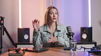 Broadcast, microphone and podcast with host woman in recording studio for broadcast or live stream. Media, news and radio report with portrait of influencer speaking on air as talk show presenter