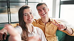 Couple, selfie and love on sofa in home posting on social media, mobile app or internet. Man, woman and peace sign for bonding, profile picture or relationship with technology in house living room