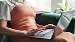 Scroll, sofa and woman hands in home with laptop, reading and editor on website for freelance career. Research, networking and girl in living room for remote work, writing and computer for online job