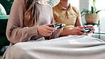 Couple, hands and play game with controller for virtual gaming, esports challenge and streaming contest on sofa. People, relax and digital device for arcade competition, bonding and house together