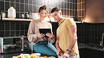 Kitchen, couple and fruits recipe on tablet for instructions, ingredients and how to for apple salad. Home, man and woman with digital for healthy diet, bonding and husband with tips for nutrition