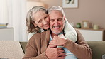 Senior couple, hug and happy in home with retirement, healthy relationship and marriage commitment. Smile, elderly man and woman with embrace in lounge for love bonding, support and loyalty with care