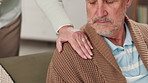 Home, couple and holding hands with comfort, love and support with grief, loss and empathy. Closeup, people and man in house, compassion and respect with trust, emotion and affection in living room