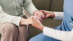 Woman, holding hands and compassion for senior care with nurse, consultation and support in nursing home lounge. Healthcare, trust and professional in retirement house, caregiver and comfort gesture