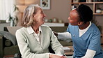 Women, caregiver and senior patient in wheelchair with smile for healthcare support, trust and love. People, nurse and person with a disability in happiness in retirement home for rehabilitation