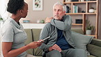 Tablet, physical therapy and senior man with shoulder pain in consultation for medical rehabilitation or health. Physiotherapist, technology or patient with injury, arthritis or osteoporosis in home