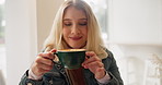 Happy woman, coffee and drink with laptop at cafe for morning beverage or caffeine at indoor restaurant. Young female person with smile for warm latte, cappuccino or espresso on computer at shop