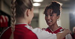 Conversation, smile and soccer player friends in locker room of venue for game, match or sports. Exercise, fitness and health with football women speaking for competition, motivation or teamwork