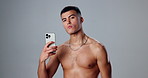 Influencer, man and selfie for face in in studio on grey background for social media campaign. Topless person, portrait and fitness model with confidence, picture or chain for live streaming or vlog