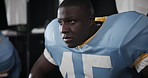 Black man, football and locker with helmet for game, match or break in half time, rest or recovery. Tired African, frustrated athlete or sports player in regret for bad decision, gameplay or mistake