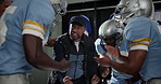 Black man, football and hands together with coach for motivation, meeting or teamwork on game plan in locker room. African mentor or group piling for unity, collaboration or preparation for next half