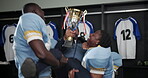 American football, men and trophy with celebration for winning tournament, match and game. Sports club, teamwork and happy as players with victory, winning and success on competition with pride