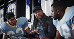 Coach, American football and team talk in locker room with tablet, listening and planning for game. Men, touchscreen and club manager with advice, strategy and direction for competition in Florida