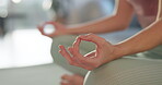 Woman, hands and meditation on floor in home for mindfulness, balance or mental health awareness. Peace, zen and female person with chakra healing for holistic, self care or connection in living room