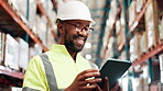 Typing, online and black man with tablet, warehouse and happy with inspection of stock and checklist. Smile, laughing and reading of email with joke, glasses and planning for shipping of cargo