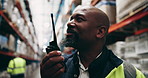Black man, contractor and communication with radio at warehouse for quality control, logistics or supply chain. African supplier, male person or storage manager talking for maintenance on inventory
