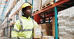 Black man, contractor and supplier with box at warehouse for storage, delivery or inspection in logistics. Young African, male person or courier checking stock, shelf or inventory for supply chain