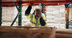 Stress, black man and logistics worker in warehouse with headache for stock inventory for distribution. Industry, burnout and African male supply chain operator for freight shipping in storage.