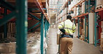 Warehouse, shipping and man with back pain, burnout and overworked with distribution deadline. Person, supply chain and employee with joint injury, muscle tension and logistics with pressure on spine