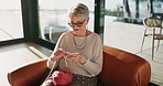 Relax, knitting and elderly woman in cafe with creative hobby, calm morning and break on retirement holiday. Wool, yarn and old person in restaurant with peace, wellness and handmade craft on weekend