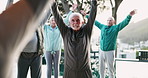 Exercise, personal trainer and stretching with senior yoga class outdoor in city for fitness or wellness. Mobility, pilates or rehabilitation and elderly people with coach for balance or breathing