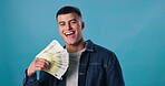 Happy man, cash fan and portrait with prize, gambling profit and wealth isolated on blue background. Euros, cashback and lottery winner with money payment, financial freedom and reward with bonus