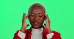 Frustrated, black woman and headache with pain on green screen in stress or pressure on a studio background. Young African, female person or model with sore migraine from strain, tension or anxiety