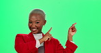 Happy, black woman and pointing with green screen in marketing or advertising on a studio background. Portrait of young African or female person showing notification, alert or message on mockup space