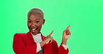 Happy, black woman and pointing with green screen for notification, deal or offer on a studio background. Portrait of young African or female person with smile for advertising or marketing on mockup