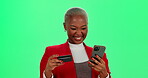 Credit card, phone and woman on green screen for online shopping of bargain or sale in studio. App, ecommerce and fintech with happy African customer on mockup for payment, purchase or retail