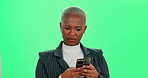 Confused, texting and black woman with mobile on green screen for notification, spam email or communication fail. Contact, question and person with smartphone for fake news, gossip or negative review