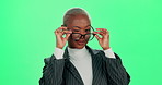 Business, green screen and black woman with wink, glasses and flirty on studio background. African person, happy employee and consultant with eyewear, funny sign and comic with secret, deal and smile