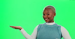 Black woman, pointing and green screen for presentation, promotion and mockup space with hand. Fashion, marketing and branding for product placement, deal and advertising with discount in studio