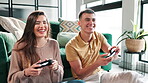 Couple, happy and play game with controller for virtual gaming, esports challenge and streaming contest on sofa. People, relax and digital device for arcade competition, bonding and house together