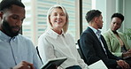 Business, people and waiting room in row for job interview at office with research, conversation and write notes. Candidate, hiring process and smile for recruitment, career opportunity and prepare